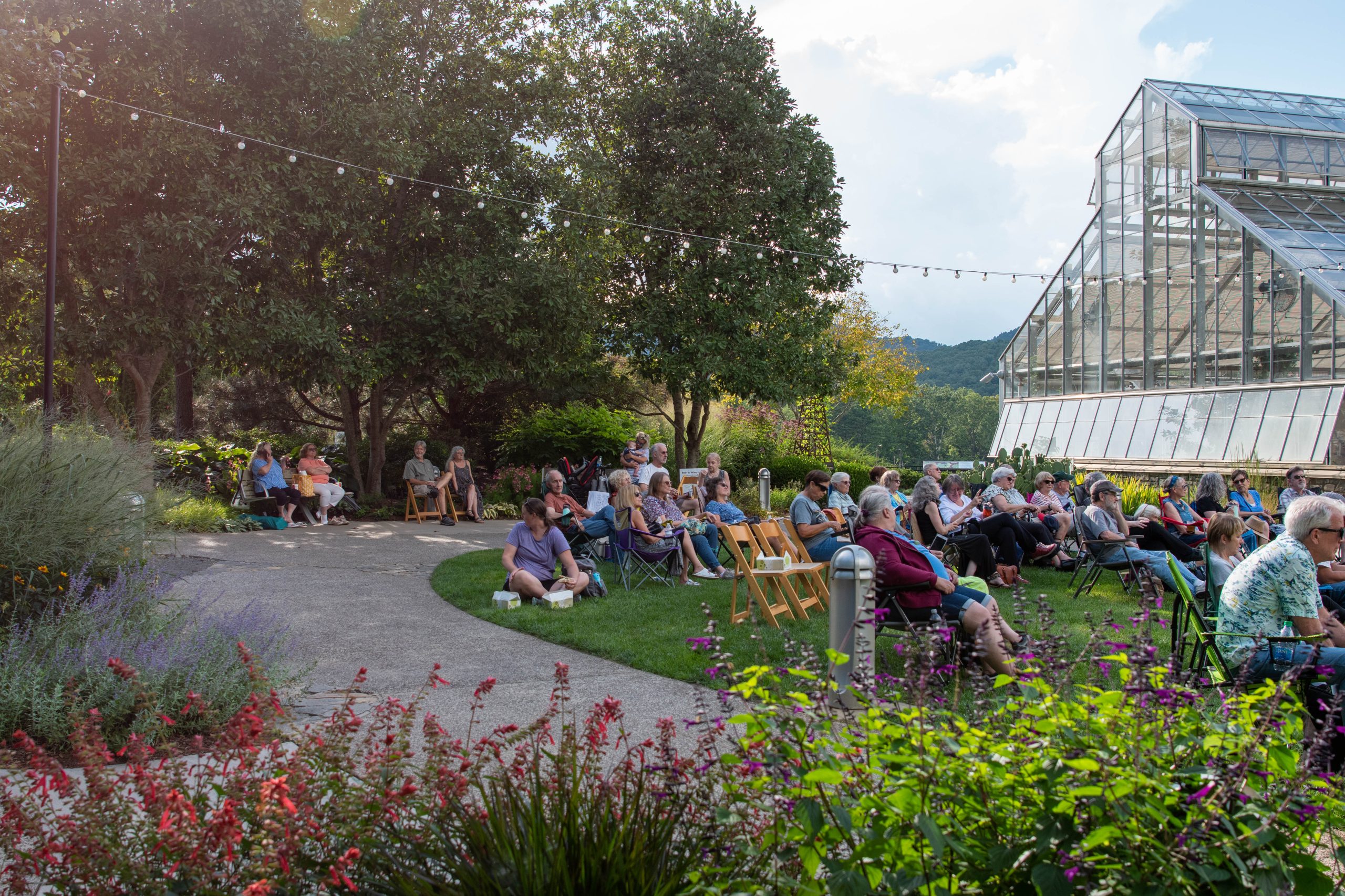 Guests sit on the Baker Event Lawn for an Arbor Evenings event