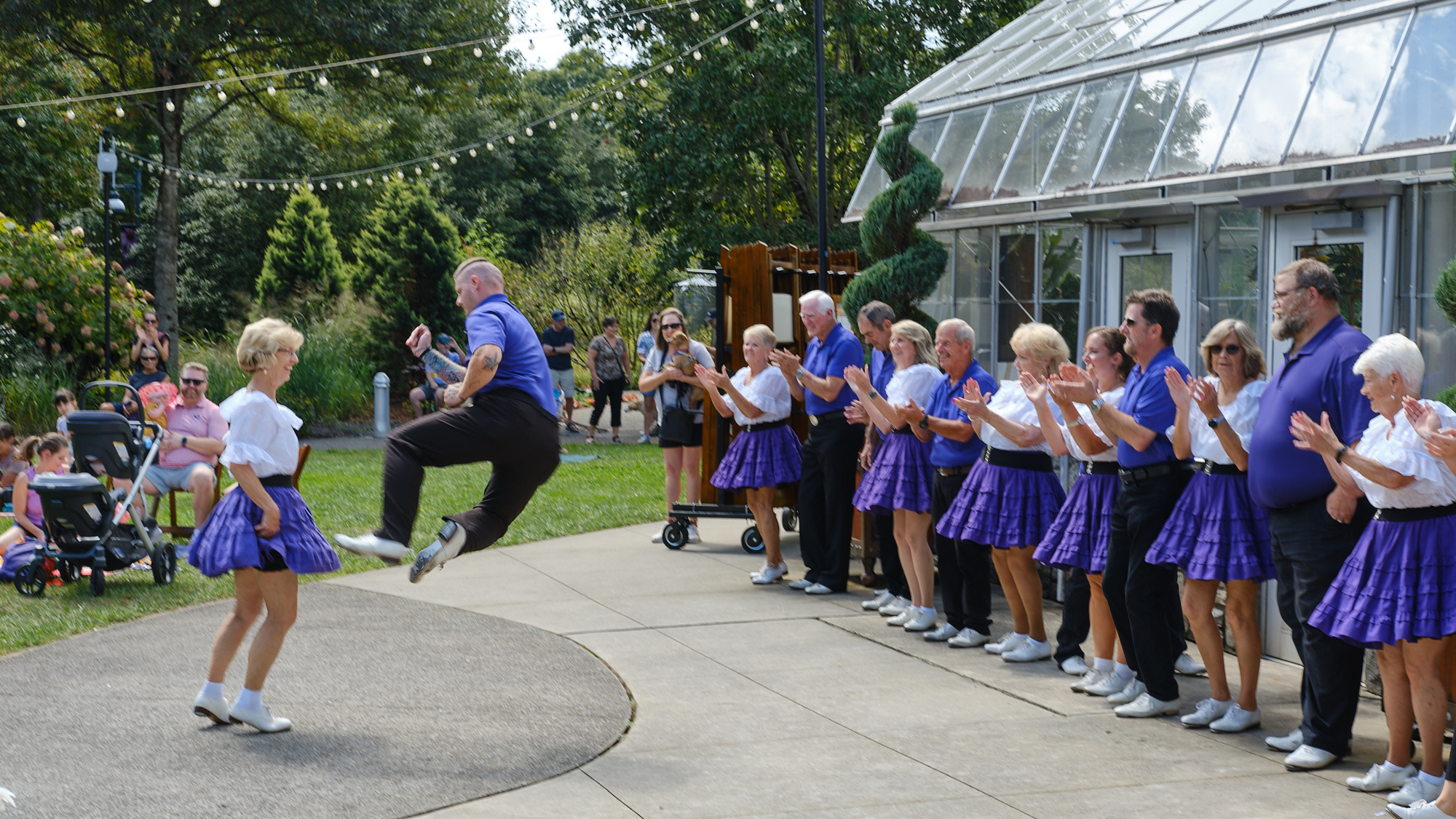Group of cloggers - man jumping in the air
