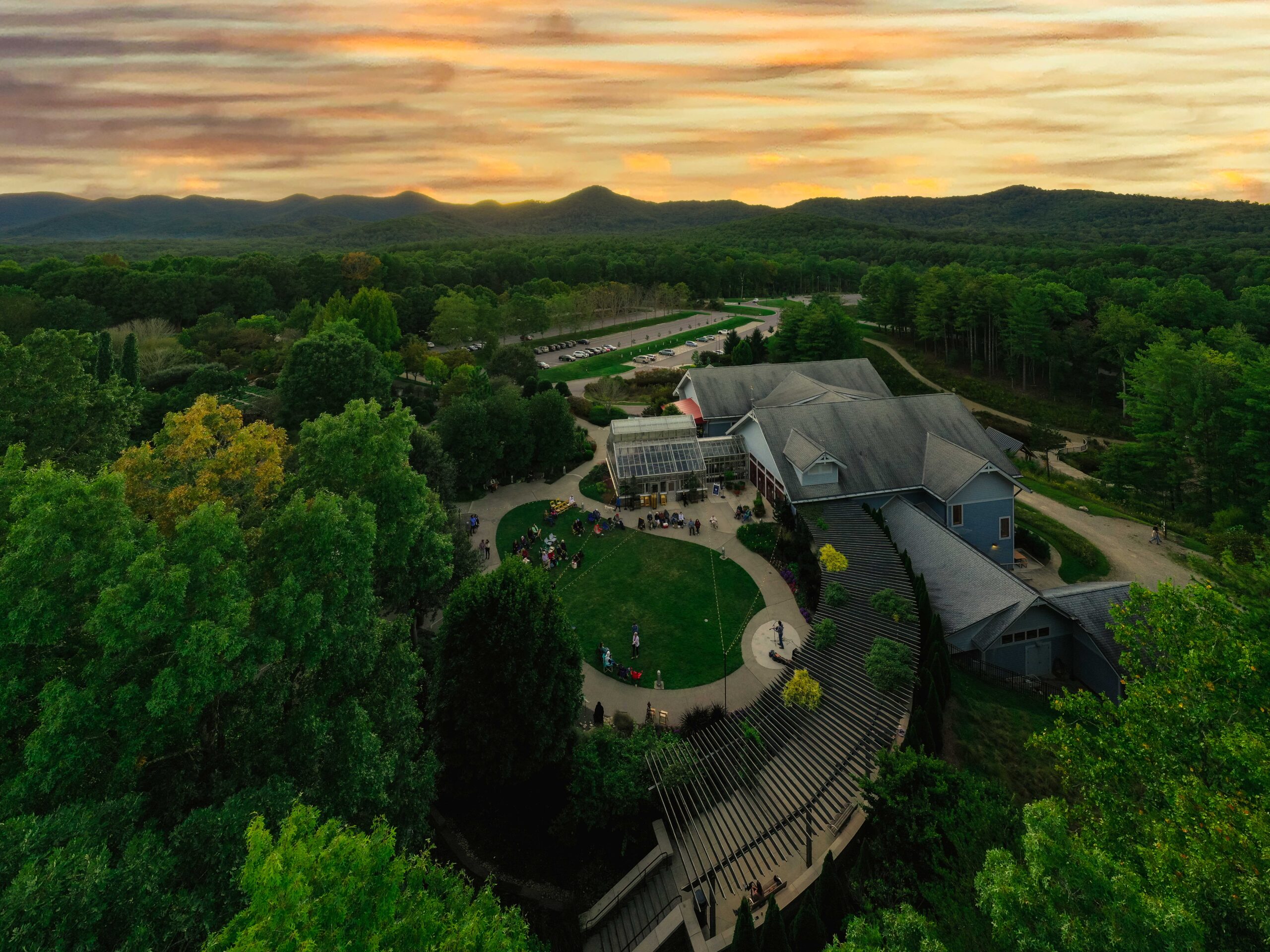 Drone image of mountains at sunset and Baker Visitor Center